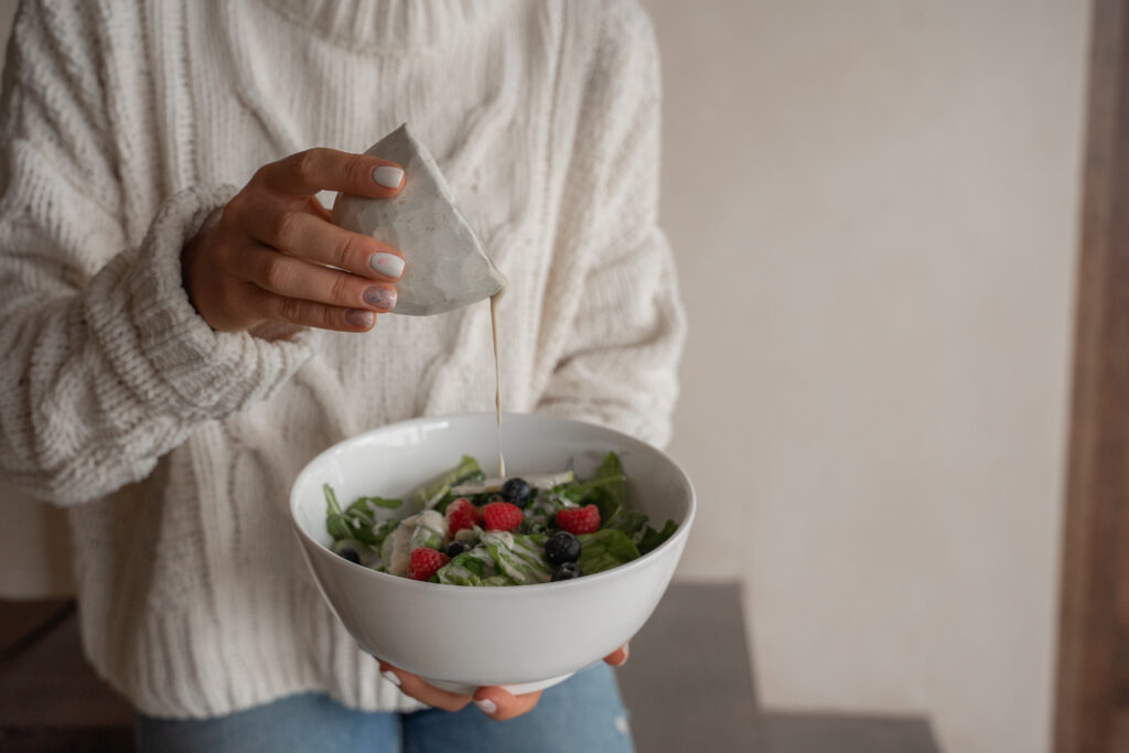 A person holding a bowl of food

Description automatically generated with low confidence